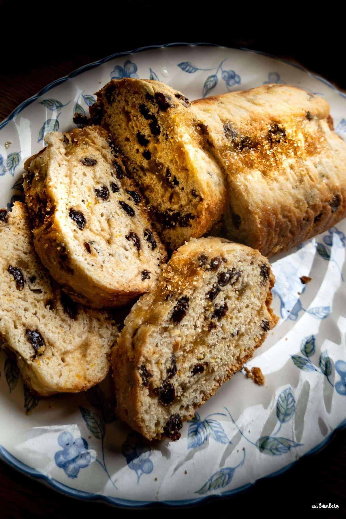 citrus roly poly spotted dick slices on a plate - portrait