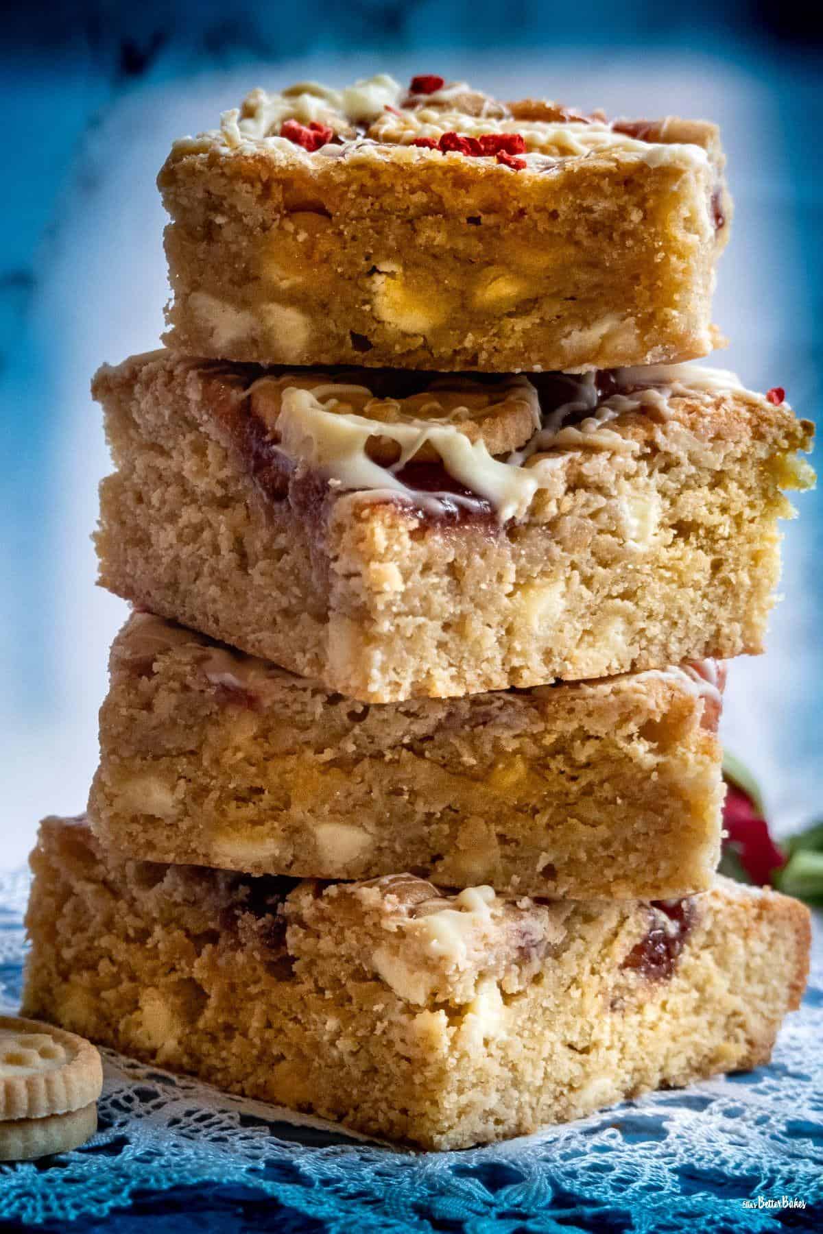 stack of jammy dodger blondies with blue background