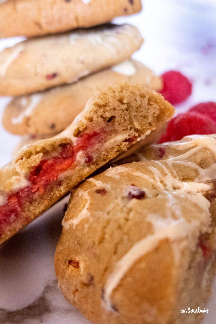 close up of cut raspberry and white chocolate cookies