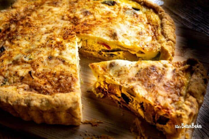 slice of roasted vegetable quiche cut