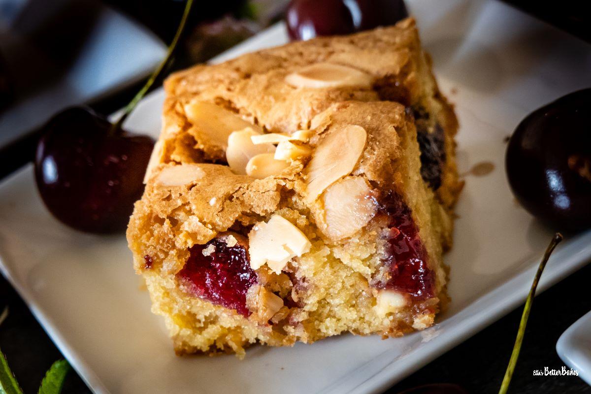 cherry bakewell on a plate with cherries