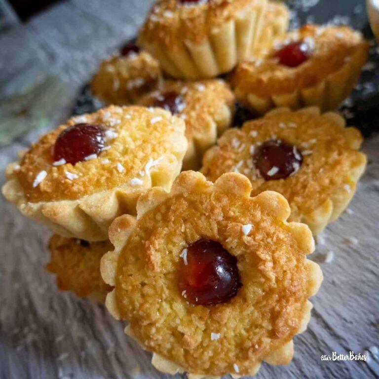 coconut tarts featured image row of tarts