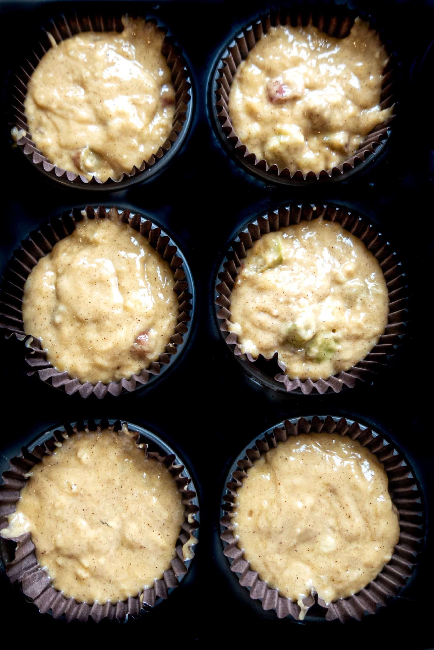 banana rhubarb muffins in tin to bake