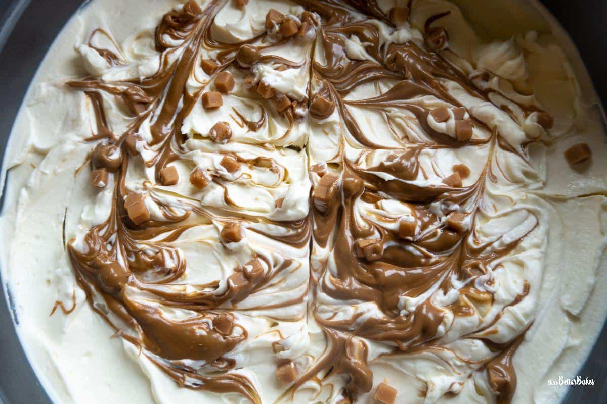 salted caramel cheesecake with layer of caramel and fudge added
