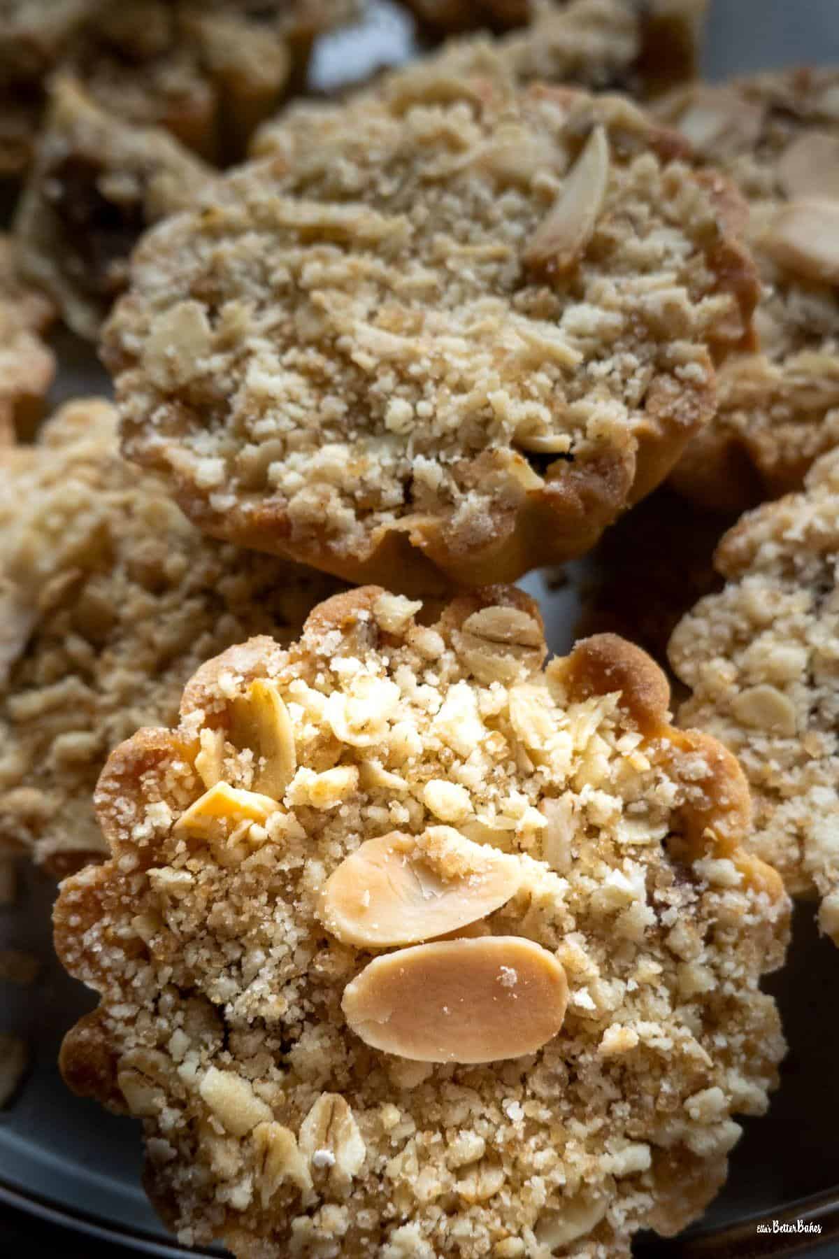 portrait of 2 apple crumble tartlets