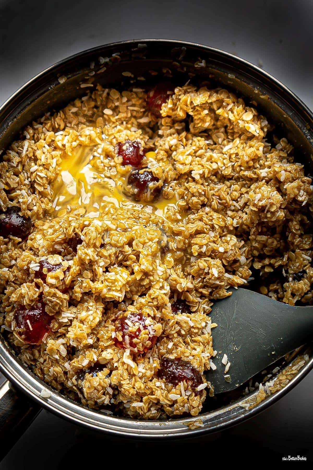 cherries and coconut added to flapjack mixture with egg