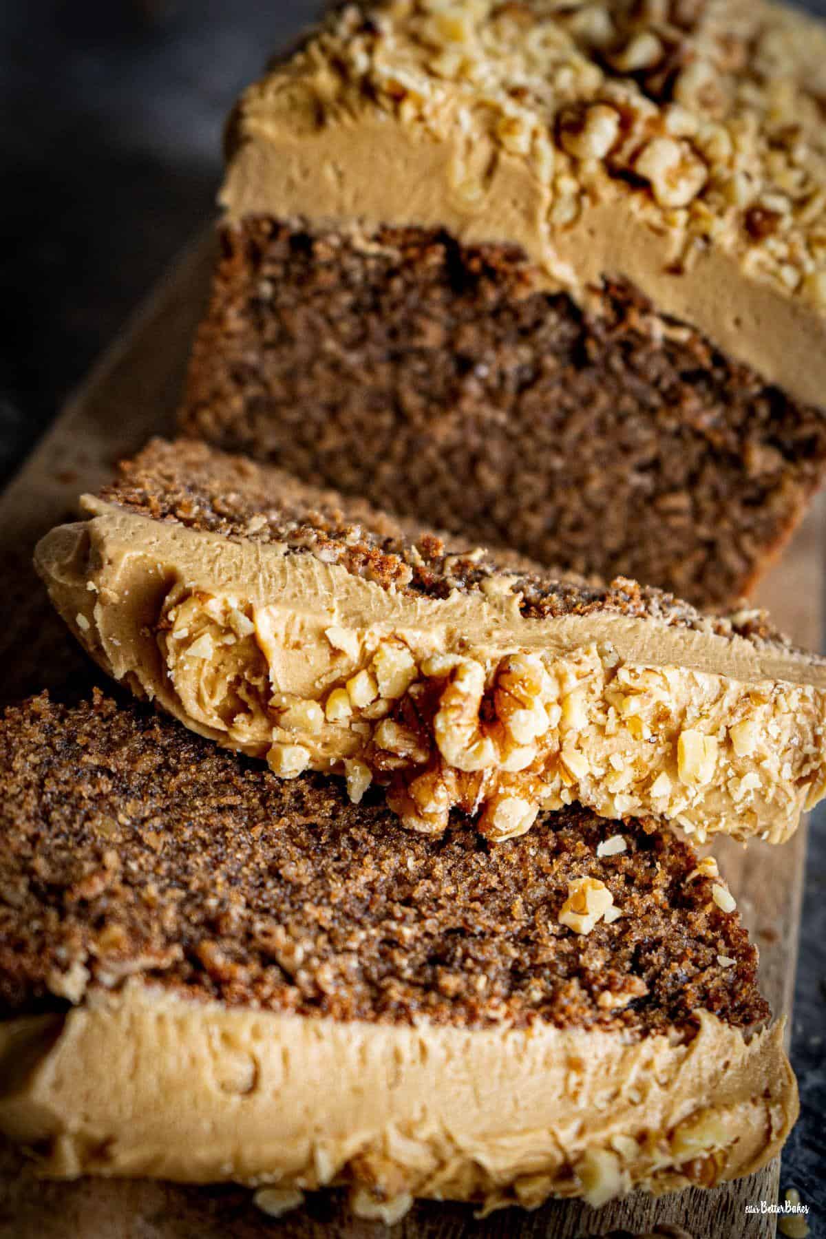 coffee and walnut loaf cake two slices cut portrait