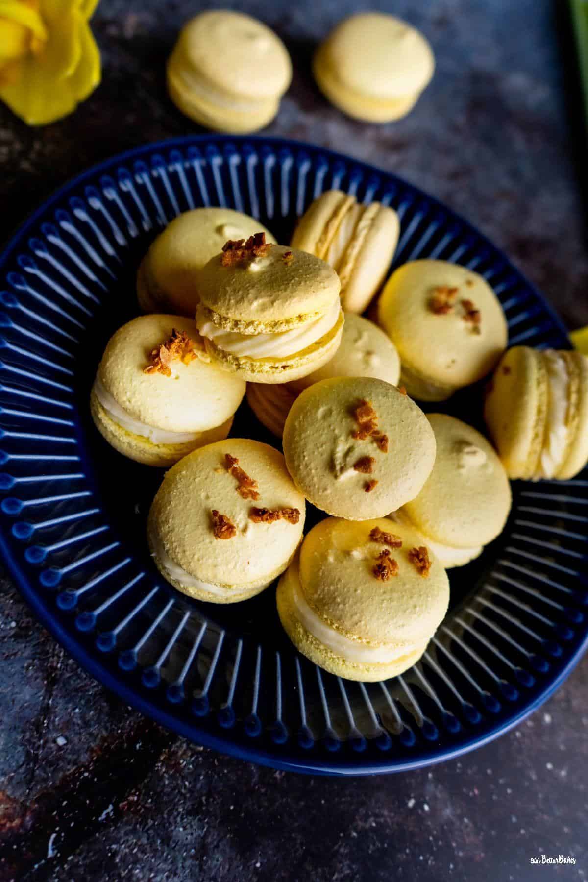 mango macarons on blue plate