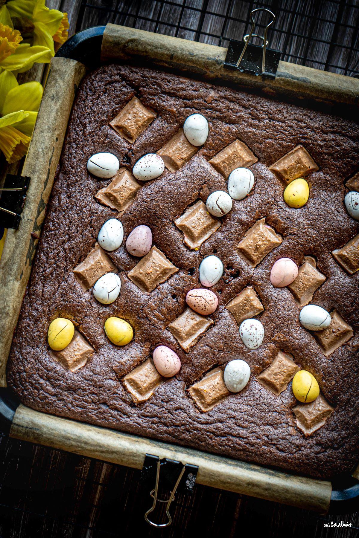 Mini egg brownies in tin ready to be baked