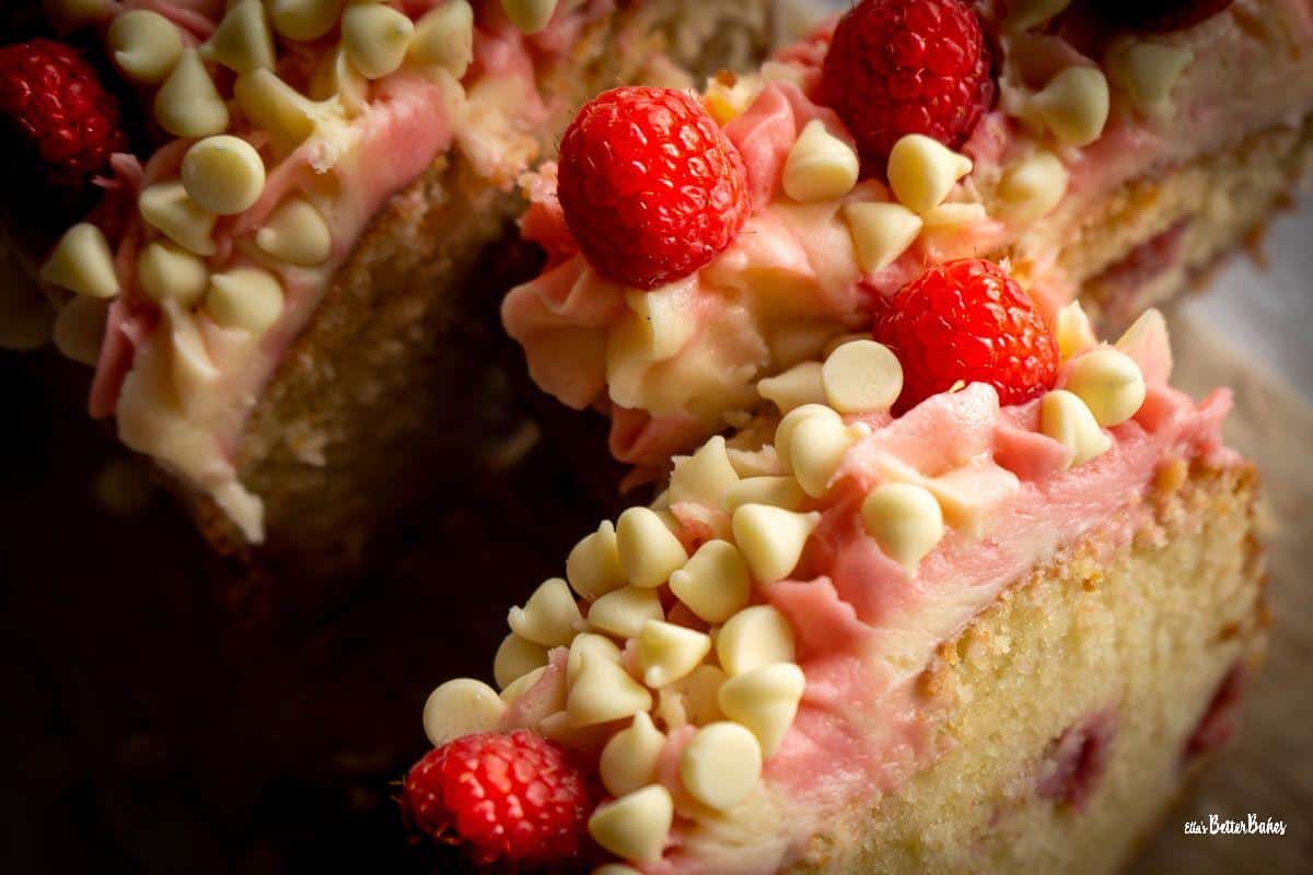 close up of cut raspberry and white chocolate cake