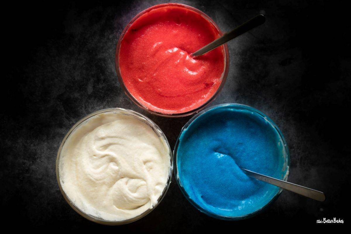 coloured cake batter in dishes