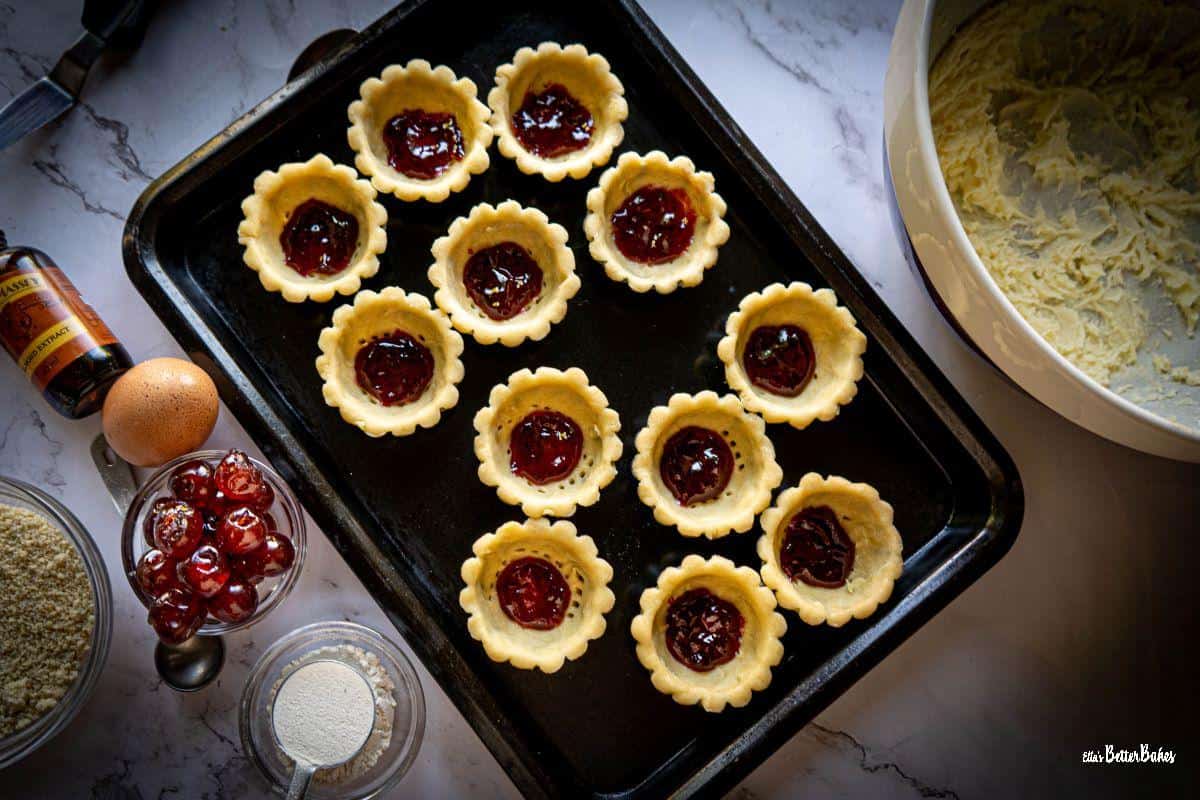 cherry jam added to pastry cases