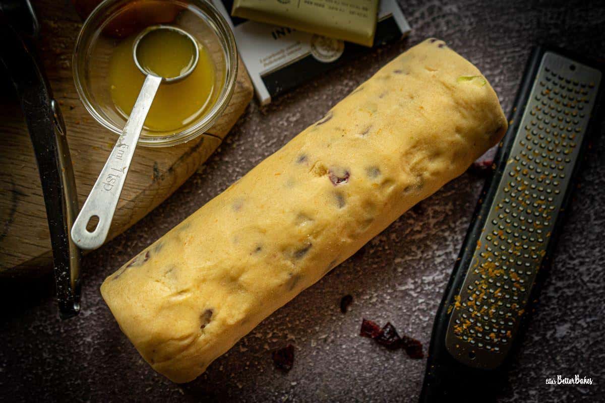 cranberry and pistachio shortbread rolled into a sausage shape