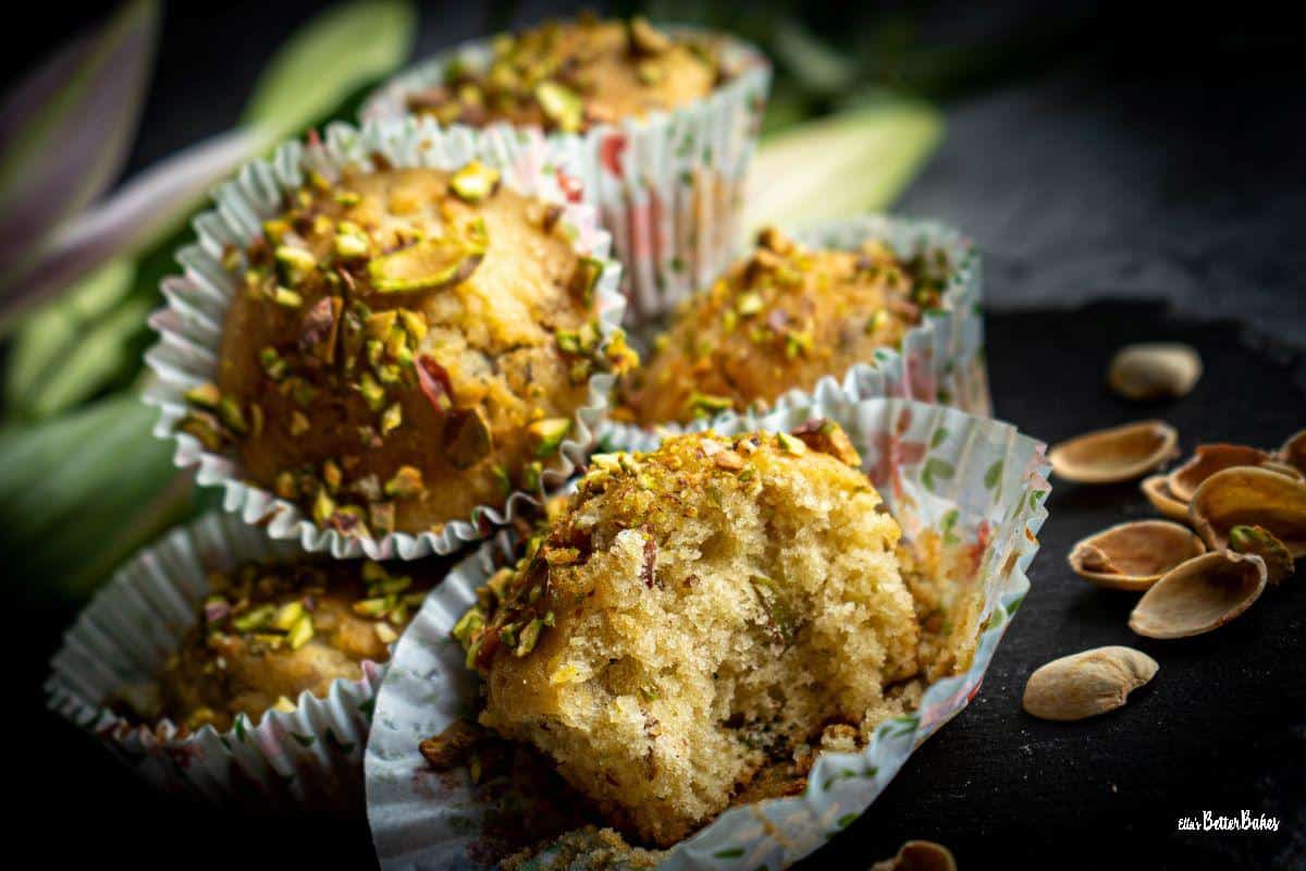 stacked pistachio muffins with one cut in half