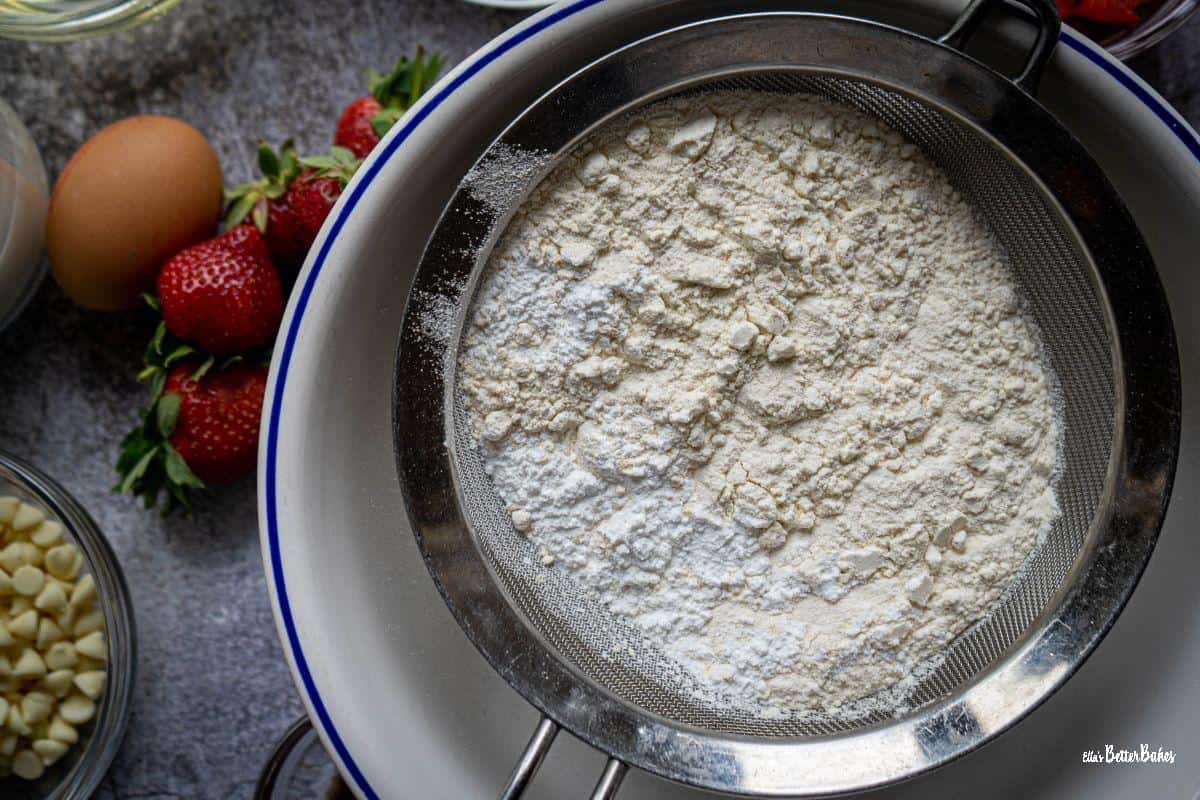 flour, salt, sugar and baking powder in sieve