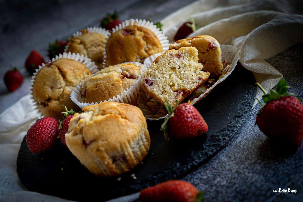 strawberry and white chocolate muffins with one cut