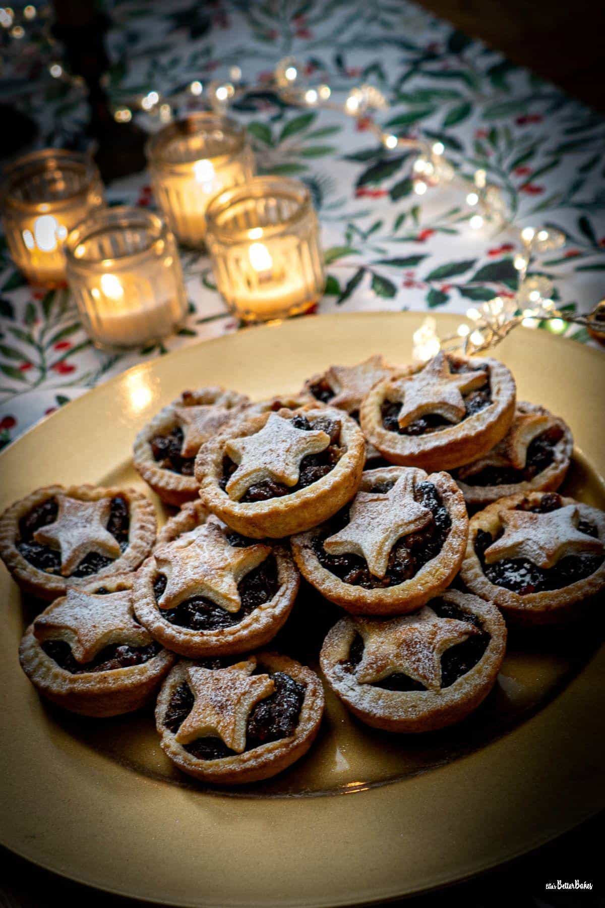 portrait size picture of plate of mince pies on table runner