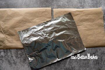 cut pieces of greaseproof paper and foil