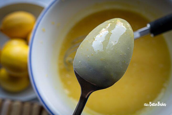 lemon curd coating the back of a spoon