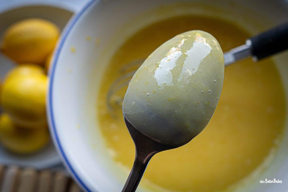 lemon curd coating the back of a spoon