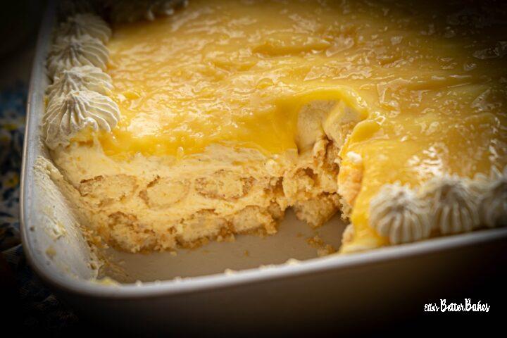 lemon tiramisu showing a piece cut out