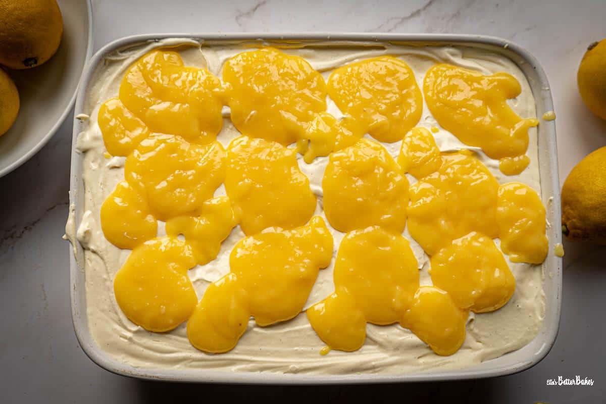 rest of the lemon curd placed on top of the final mascarpone cream layer