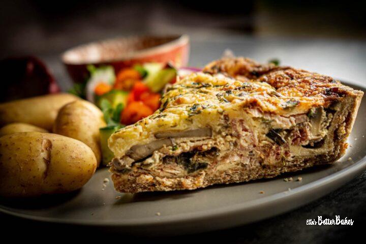 piece of bacon and mushroom quiche cut