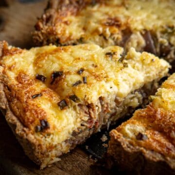 piece of bacon and mushroom quiche cut