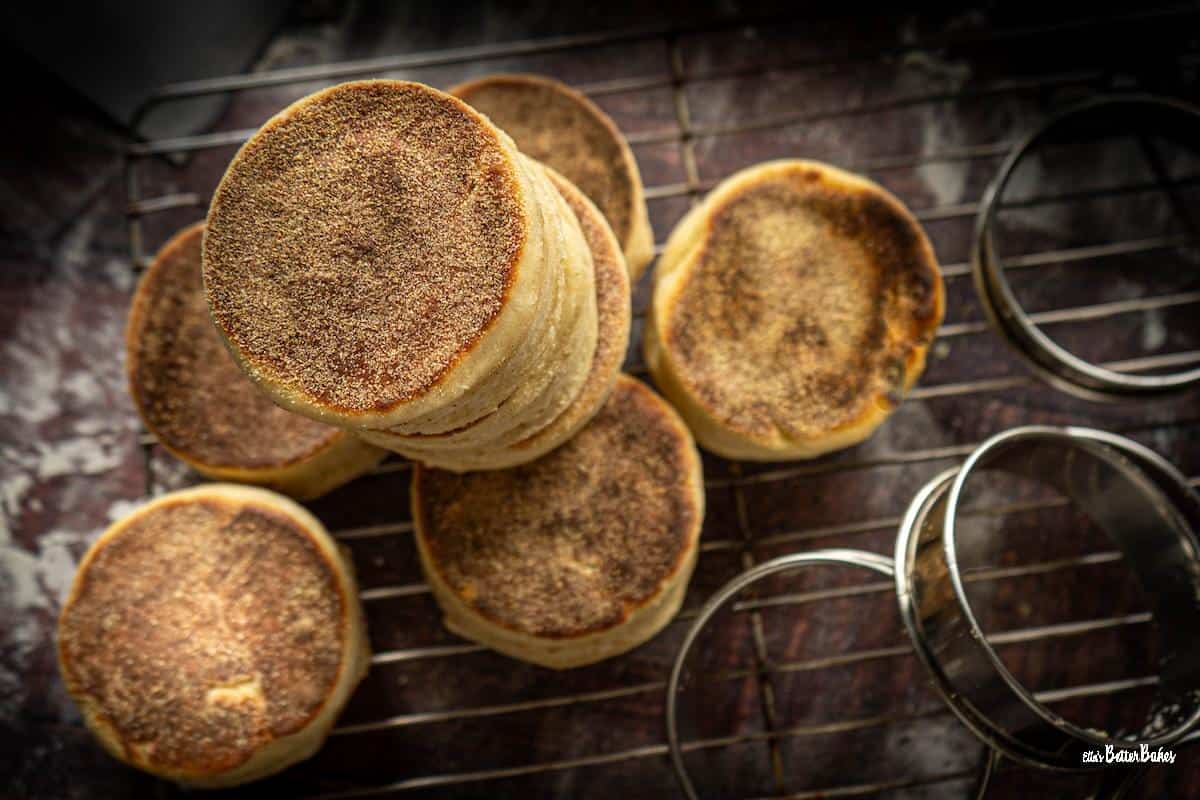 sourdough english muffins on a cooling rack