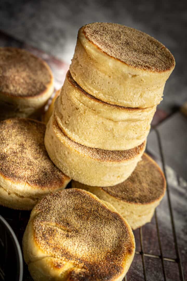 stack of 3 sourdough discard english muffins next so some other muffins