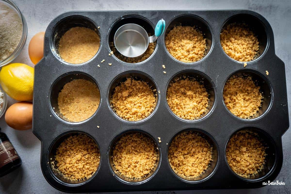 biscuit base pressed into tin for strawberry cheesecakes