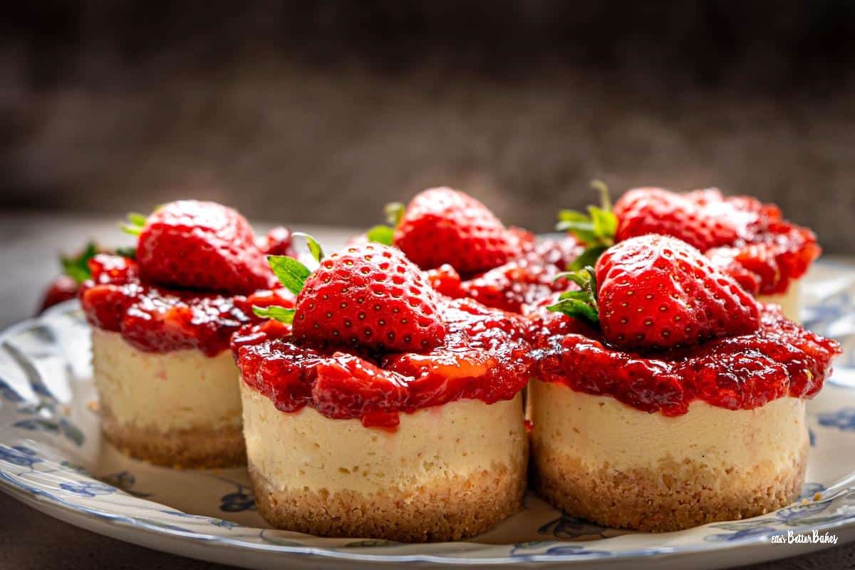 close up of roasted strawberry cheesecakes on a plate