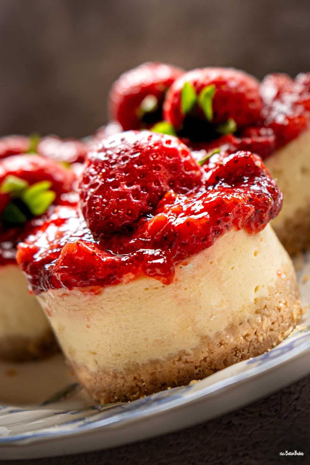 portrait size of close up of strawberry cheesecake on a slant