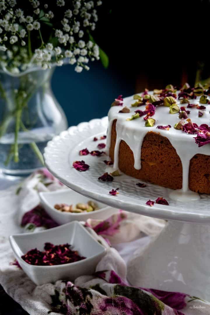 persian love cake and vase of flowers