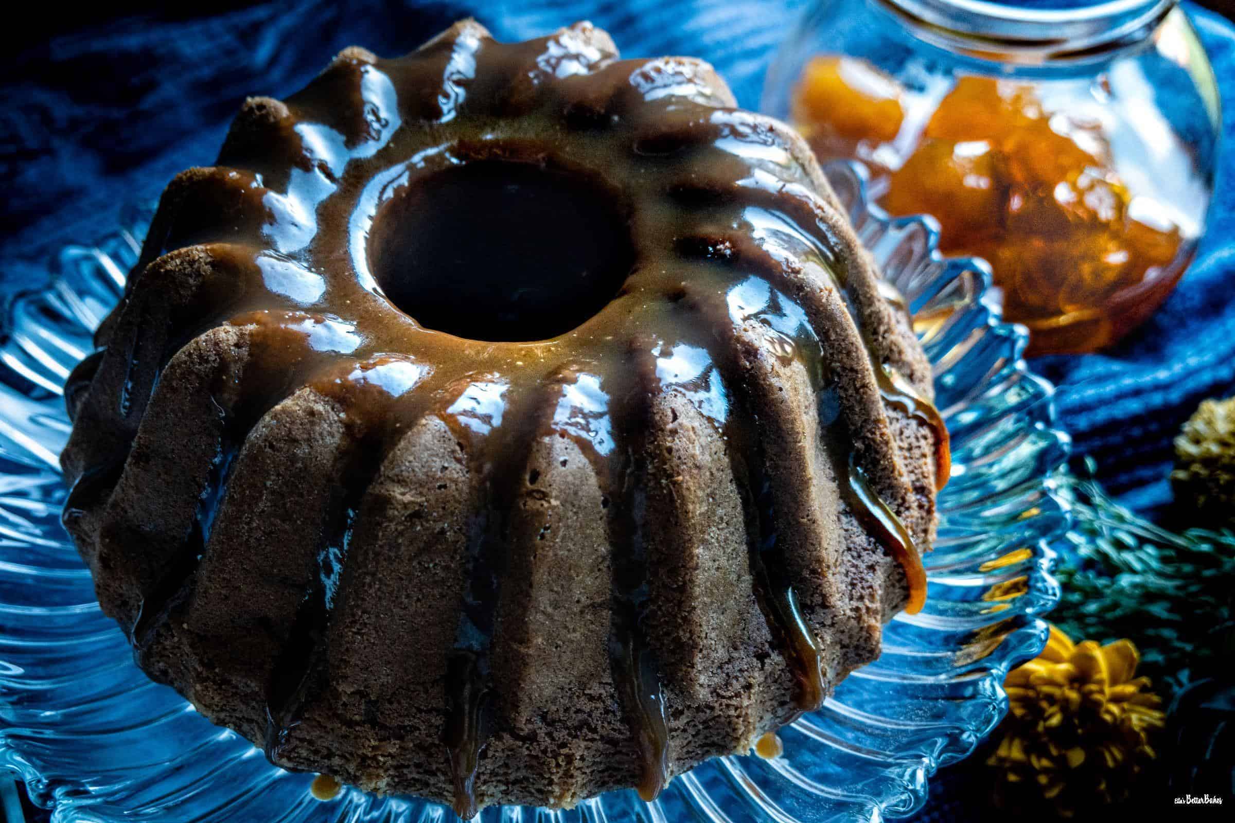 bundt cake with ginger and flowers to the right - sticky toffee and ginger pudding 